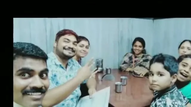 Sevagan Satheesh with a family and their children